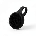 Black silicone face scrubber with handle