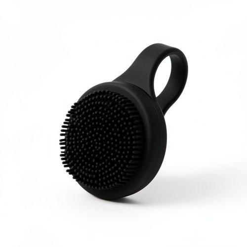 Black silicone face scrubber with handle